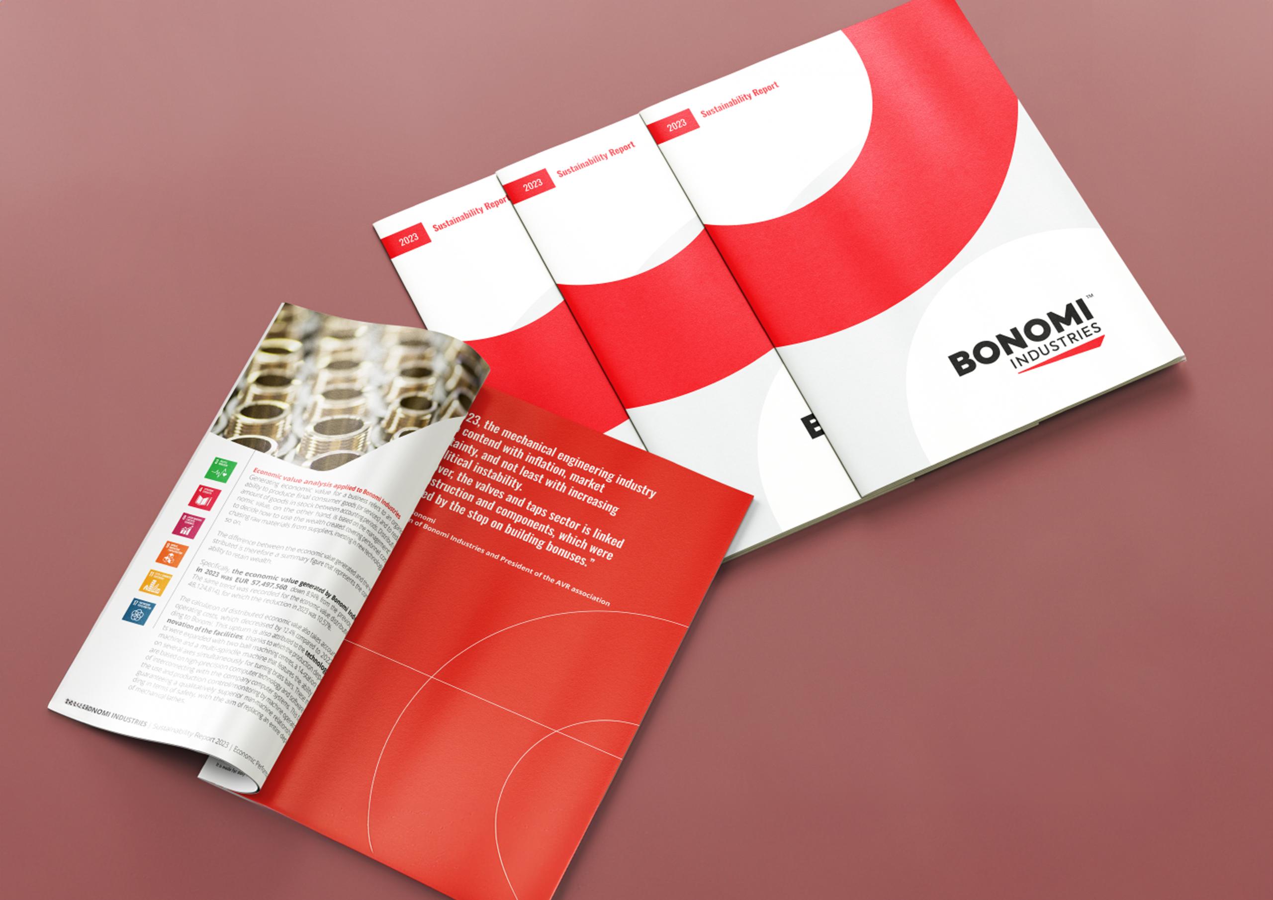 Image showing multiple copies of the Bonomi Industries' first Sustainability Report (2023). The reports have a clean, modern design with a red and white color scheme and the Bonomi Industries logo prominently displayed. One of the reports is open, revealing text and icons representing various sustainability goals.